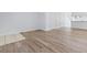 Open living area with light walls and wood-look floors at 618 3Rd Ave. S # 4B, North Myrtle Beach, SC 29582