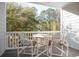 Private balcony with table and chairs, wooded views at 6253 Catalina Dr. # 1523, North Myrtle Beach, SC 29582