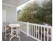 Balcony with table and chairs overlooking trees at 6253 Catalina Dr. # 1523, North Myrtle Beach, SC 29582