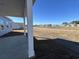 Covered patio overlooks a spacious backyard with pond views at 640 Carter Reid Ct., Conway, SC 29526