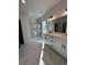Elegant bathroom with marble flooring, a walk-in shower, and double vanity at 640 Carter Reid Ct., Conway, SC 29526