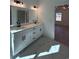 Bathroom with double vanity, marble flooring and a view into bedroom at 640 Carter Reid Ct., Conway, SC 29526