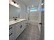 Bathroom with white vanity, patterned floor, and shower/tub combo at 640 Carter Reid Ct., Conway, SC 29526