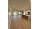 Open concept kitchen, island, white cabinets, wood beams at 640 Carter Reid Ct., Conway, SC 29526