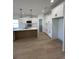 Modern kitchen featuring white cabinets, a large island, and stainless steel appliances at 640 Carter Reid Ct., Conway, SC 29526