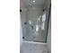 Spacious walk-in shower with marble tile and glass enclosure at 640 Carter Reid Ct., Conway, SC 29526