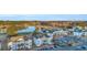 Scenic aerial view showcases condominiums near a lake and golf course, providing a serene setting with ample community parking at 661 Tupelo Ln. # 16B, Longs, SC 29568