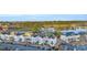 Scenic aerial view of a condominium complex near a golf course and lake providing beautiful views and convenient community parking at 661 Tupelo Ln. # 16B, Longs, SC 29568
