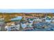 Scenic aerial view showcases condominiums near a lake and golf course, providing a serene setting with ample community parking at 661 Tupelo Ln. # 16B, Longs, SC 29568