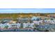 Aerial view of a condominium complex situated near a golf course and lake, highlighting a desirable community living environment at 661 Tupelo Ln. # 16B, Longs, SC 29568