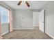 Bright bedroom with a ceiling fan and natural light from the window at 661 Tupelo Ln. # 16B, Longs, SC 29568