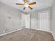 Clean, empty bedroom with neutral walls, carpet, and standard closet at 661 Tupelo Ln. # 16B, Longs, SC 29568