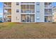 A ground level view of the apartment complex, each unit with a screened-in porch at 661 Tupelo Ln. # 16B, Longs, SC 29568