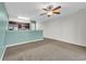 Open living room adjacent to kitchen, with neutral tones and a ceiling fan at 661 Tupelo Ln. # 16B, Longs, SC 29568