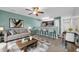 Stylishly decorated living room open to the kitchen, with neutral tones and a ceiling fan at 661 Tupelo Ln. # 16B, Longs, SC 29568