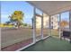 Screened in porch overlooking the green golf course and the beautiful blue skies at 661 Tupelo Ln. # 16B, Longs, SC 29568
