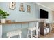 Simple bar with wooden countertop and two white stools at 6900 N Ocean Blvd. # 1439, Myrtle Beach, SC 29572