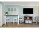Small bar area with wooden countertop and white stools at 6900 N Ocean Blvd. # 1439, Myrtle Beach, SC 29572