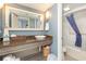 Clean bathroom with granite-topped vanity, large mirror, and shower at 6900 N Ocean Blvd. # 1439, Myrtle Beach, SC 29572