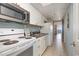 Bright kitchen featuring white cabinets and granite countertops at 6900 N Ocean Blvd. # 1439, Myrtle Beach, SC 29572