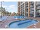 Resort-style pool with kiddie pool and lounge chairs at 6900 N Ocean Blvd. # 1439, Myrtle Beach, SC 29572