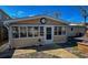 Charming sun room with many large windows offering ample natural light and a cozy atmosphere at 706 33Rd Ave. S, North Myrtle Beach, SC 29582