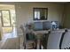 Bright dining room with glass top table and six chairs at 800 Egret Circle # 45, Little River, SC 29566