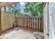 Enclosed patio with a wooden fence and lush greenery in the background at 1025 Carolina Rd. # I-7, Conway, SC 29526