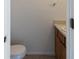 Half bathroom featuring a vanity and toilet, conveniently located off the main living area at 1025 Carolina Rd. # I-7, Conway, SC 29526
