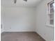 Bare bedroom with neutral carpeting and a single casement window at 1025 Carolina Rd. # I-7, Conway, SC 29526