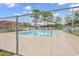 Fenced community pool area surrounded by well-maintained grounds and trees at 1025 Carolina Rd. # I-7, Conway, SC 29526