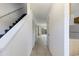 Inviting hallway with stairs, tile flooring, and access to the backyard at 1025 Carolina Rd. # I-7, Conway, SC 29526