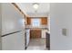 Bright kitchen with wooden cabinets, white appliances, and a window above the sink at 1025 Carolina Rd. # I-7, Conway, SC 29526
