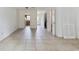 Open-concept living area with tile flooring, access to kitchen, and multiple doorways at 1025 Carolina Rd. # I-7, Conway, SC 29526