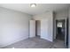 Bright bedroom with carpet, double doors leading to closet, and view of another room at 120 Telfair Rd., Georgetown, SC 29440