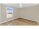 Bright bedroom with wood-look flooring and a ceiling fan at 1282 Scenic Dr., Loris, SC 29569