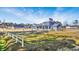 Gray house with American and thin blue line flags at 1464 W G Rd., Conway, SC 29526