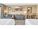 Cozy bedroom with two twin beds, dresser, and TV at 1501 S Ocean Blvd. # 321, Myrtle Beach, SC 29577