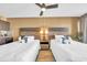 Two beds, nightstands, and ceiling fan at 1501 S Ocean Blvd. # 321, Myrtle Beach, SC 29577