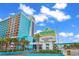 Landmark Resort exterior view, showcasing its vibrant turquoise and orange color scheme at 1501 S Ocean Blvd. # 332, Myrtle Beach, SC 29577