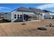 Charming single-story home with a screened-in porch and awning, set in a spacious backyard at 1519 Wood Stork Dr., Conway, SC 29526