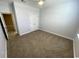 Simple bedroom with neutral carpet, ceiling fan, and a double door closet, ready for personalization at 1519 Wood Stork Dr., Conway, SC 29526