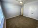 Neutrally painted bedroom with carpet, ceiling fan, double door closet, and natural light, inviting relaxation at 1519 Wood Stork Dr., Conway, SC 29526