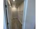 Walk-in closet providing storage space with wire shelving and wood-look floors at 1519 Wood Stork Dr., Conway, SC 29526