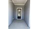 Covered front porch features stylish door and accent paneling at 1519 Wood Stork Dr., Conway, SC 29526
