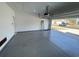 Bright garage with clean epoxy flooring, overhead lighting, offering secure vehicle storage and workspace at 1519 Wood Stork Dr., Conway, SC 29526