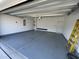 Spacious garage with epoxy flooring, overhead door, and ample space for parking and storage solutions at 1519 Wood Stork Dr., Conway, SC 29526