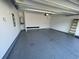 Well-lit garage featuring durable epoxy flooring, smooth walls, and an automatic door opener for added convenience at 1519 Wood Stork Dr., Conway, SC 29526