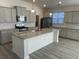 Modern kitchen with granite countertops, stainless steel appliances, and a large center island at 1519 Wood Stork Dr., Conway, SC 29526