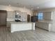Bright kitchen featuring gray cabinets, stainless steel appliances, granite counters, and a center island at 1519 Wood Stork Dr., Conway, SC 29526